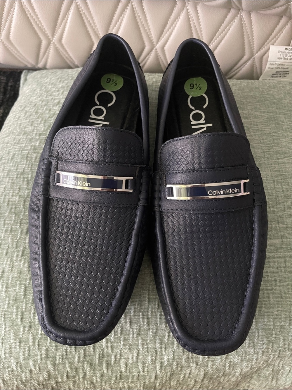 Calvin Klein Men's Black Textured Leather Slip-Ons with Silver Logo Accent